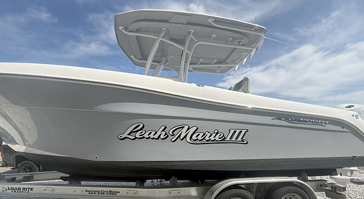 Leah Marie boat lettering in Beach Haven West, New Jersey after removal of the previous name and installation of new marine-grade vinyl graphics